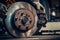 Auto master in workshop replaces old brake discs with new ones