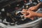 Auto mechanic cleaning the repair tools. He was holding a wrench and a ring spanner