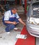 Auto Mechanic Performing Tire Pressure Inspection