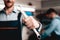 Auto Mechanic Posing With Wrench. Service Station.