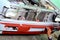 Auto mechanic preparing the front bumper of a car for painting