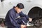 Auto mechanic repairman with a checklist, Technician checking modern car at garage, Car repair and maintenance concepts
