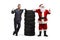 Auto mechanic and Santa Claus with a pile of tires showing thumbs up