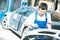 Auto mechanic worker polishing bumper car