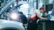 Auto mechanic works on a car at a repair shop