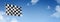 Auto racing finish checkered flag isolated on a blue sky