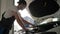 Auto repairman in slow motion, men in backlight, mechanician repair