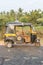 Auto rickshaw seen from the side, tuk-tuk on the road, Hampi