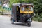 Auto rickshaw taxi on a road in Srinagar, Kashmir, India.