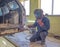 Auto welder in the process of welding a car body in a workshop. auto repair concept