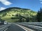 Autobahn on a background of mountains with houses