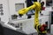 Automated CNC machine loading with robotic arm