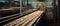 Automated conveyor belt transports bread and rolls in a bakery.