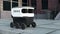 Automated Delivery Robot Service Driving City Street with Goods to People Home