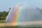 Automated irrigation in agriculture in summer with rainbow