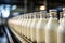 Automated process of filling milk or yogurt into plastic bottles at a modern dairy plant