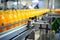 Automated Robotic Orange Juice Production Line. Industrial food production plant indoors