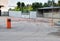 Automatic barrier, entry into the territory, blocking the way, orange red barrier, metal fence