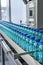 automatic conveyor belt with glass bottles of Immunizing serum AI generated