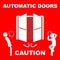 Automatic doors sign with the text caution