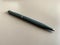 Automatic green ballpoint pen for writing on your desktop office desk. Business work