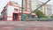 Automatic green gates on a background of red buildings