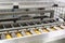 Automatic modern custard cake line with cream and boiled condensed milk. Confectionery manufacturing sweets