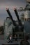 The automatic naval cannon AK-130 and children on cloudy day closeup