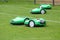 Automatic robotic lawnmower on green grass in the stadium