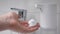 Automatic soap foam dispenser in the bathroom. An element of a modern smart home. Sensory control of the soap.