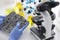 Automatic transmission lies in rubber gloves on table with microscope and test tubes in chemical laboratory closeup