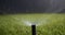 Automatic watering system watering the garden. Bottom view of the high-pressure nozzle