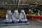 Automobile chairs in packing stand in assembly shop of automobile plant