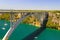 Automobile long high arched bridge over the Krka river in Croatia near Sibenik. Picturesque Croatian river landscape in