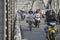 Automobile and pedestrian steel bridge over the river in Hue town, Vietnam. People on motorbikes on the road across the bridge