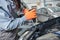 Automobile repair shop. Worker assembling car body