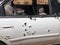 Automobile shot up bullet gun fire holes