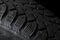 Automobile tire on black background