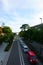 Automobile traffic on the road in Kamakura city. Torii gate in the background