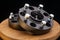 Automotive parts - close up new stainless black metal remote adapter spacer wheel hub of the car on black background