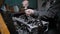 Automotive technician is tightening bolts on a piston group in a car engine after repair in a auto-service