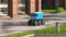 Autonomous delivery robot drives along the street