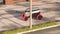 Autonomous delivery robot drives on sunset street