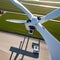 An autonomous drone inspecting a wind turbine for maintenance1