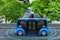 Autonomous electric shuttle bus self driving across city green road, Smart vehicle concept