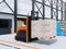 Autonomous forklift carrying pallet of goods in logistics center