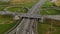 Autos drive along highway multilevel traffic intersection