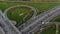 Autos drive along highway multilevel traffic intersection