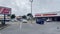 AutoZone auto parts retail store exterior and people on a cloudy day