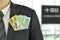 Autralian dollar banknotes in the suit pocket